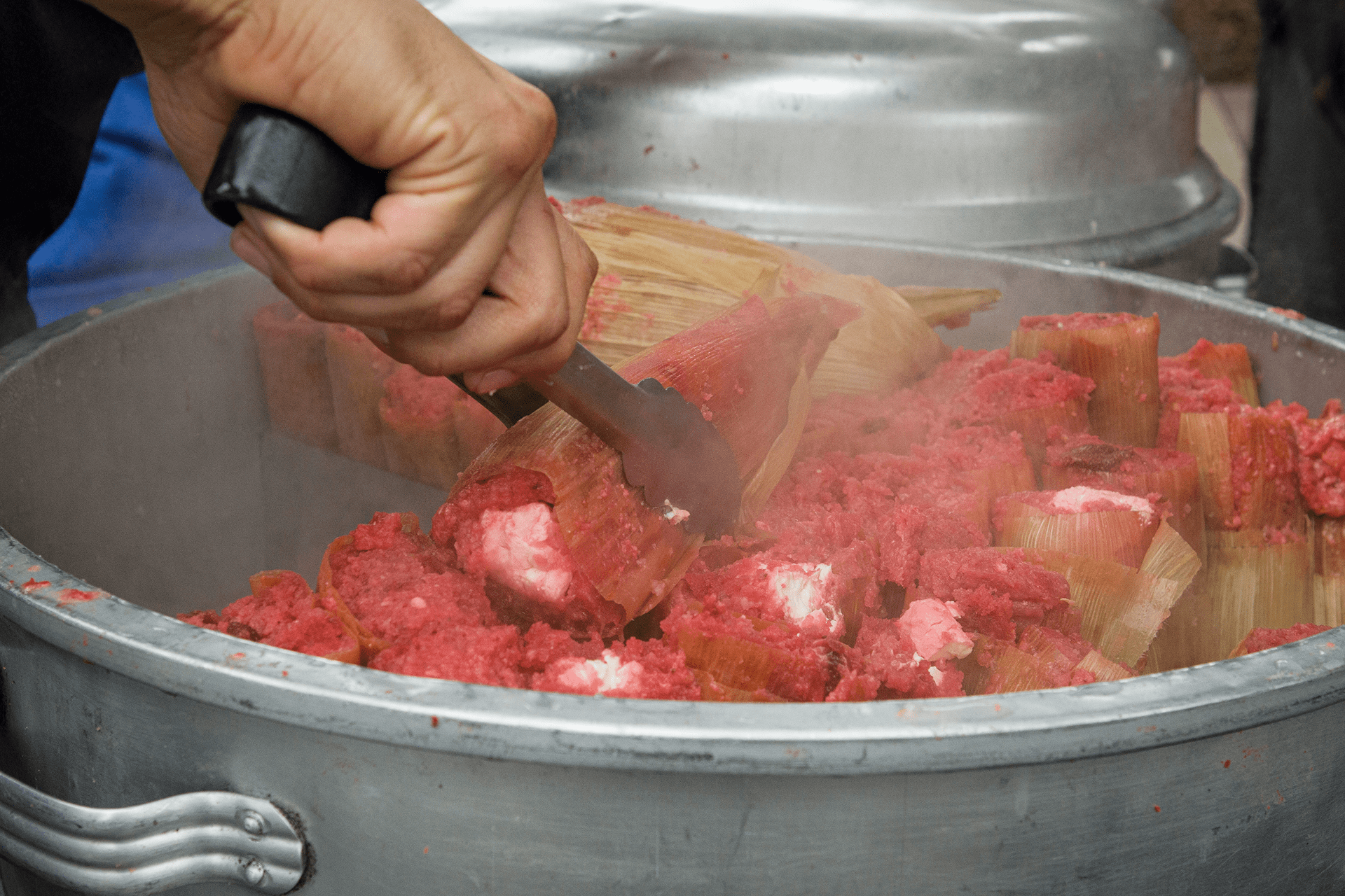 Photo of steaming gourmet tamales in a pot